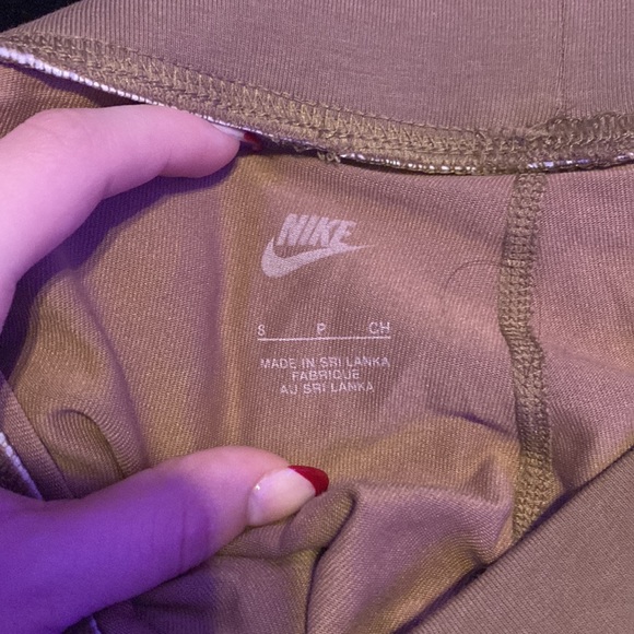 Brown Nike Leggings. Never Worn Before. Camo nike symbol with gold outline. - Picture 2 of 3